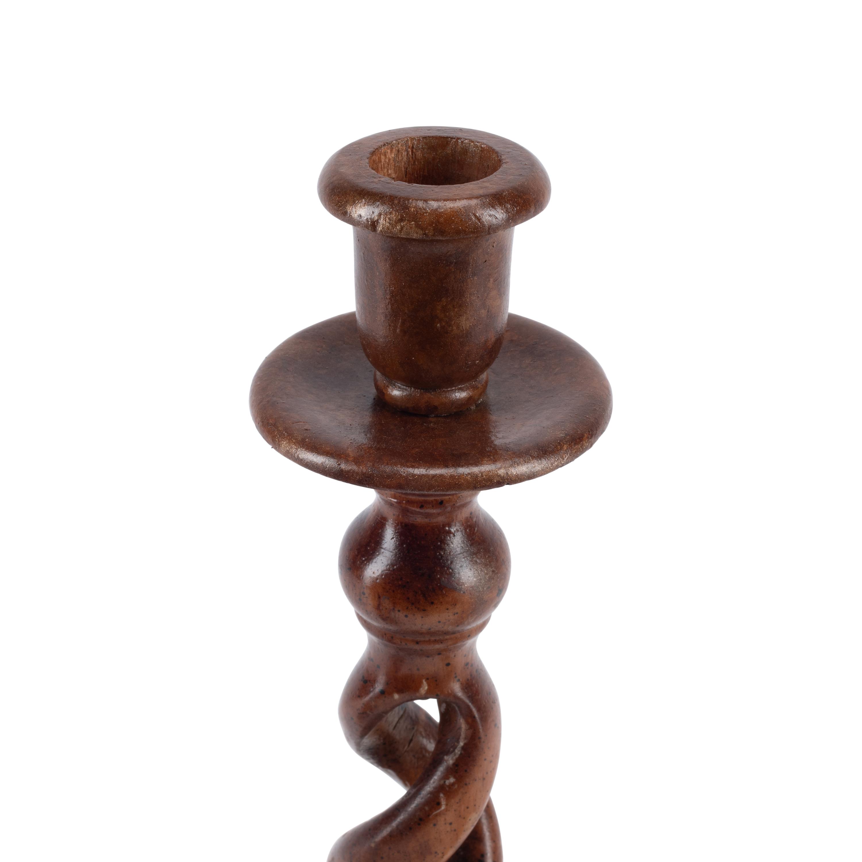 A Group of Seven Turned Wood Candlesticks