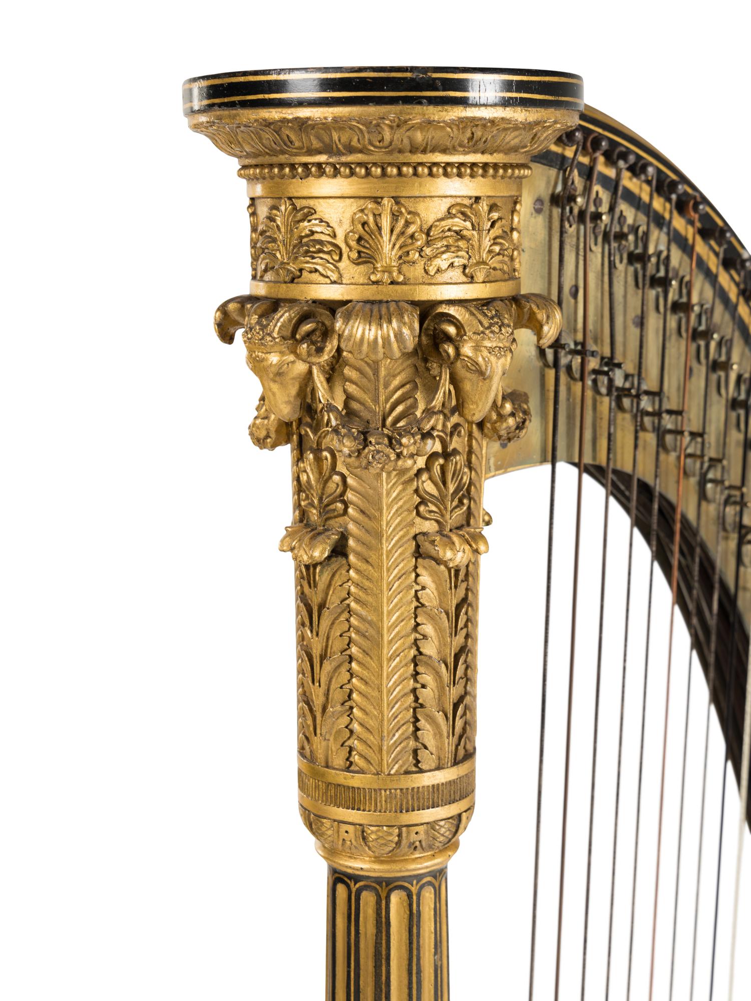 A Regency Brass Mounted, Stencil Decorated, Parcel Gilt and Ebonized Harp