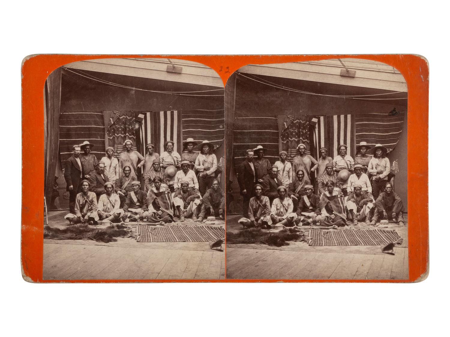 [NATIVE AMERICANS]. Group of Navajo Indians from Northern Arizona, with samples of Blankets made by them . Salt Lake City, UT: C.R. Savage, ca 1875.