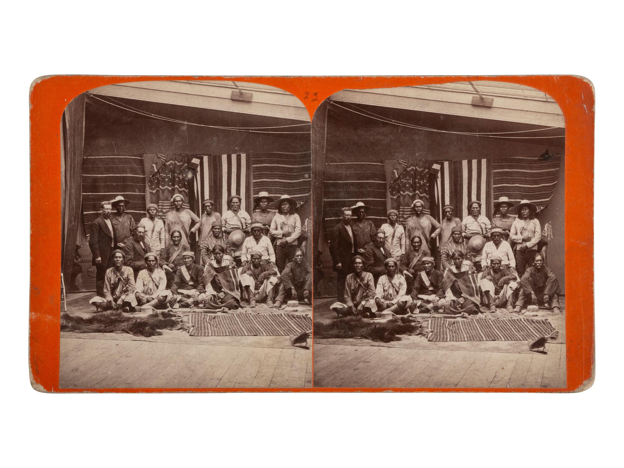 [NATIVE AMERICANS]. Group of Navajo Indians from Northern Arizona, with samples of Blankets made by them . Salt Lake City, UT: C.R. Savage, ca 1875.