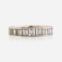 A diamond and fourteen karat white gold eternity band