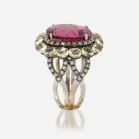 A pink tourmaline, peridot, diamond, and eighteen karat gold ring
