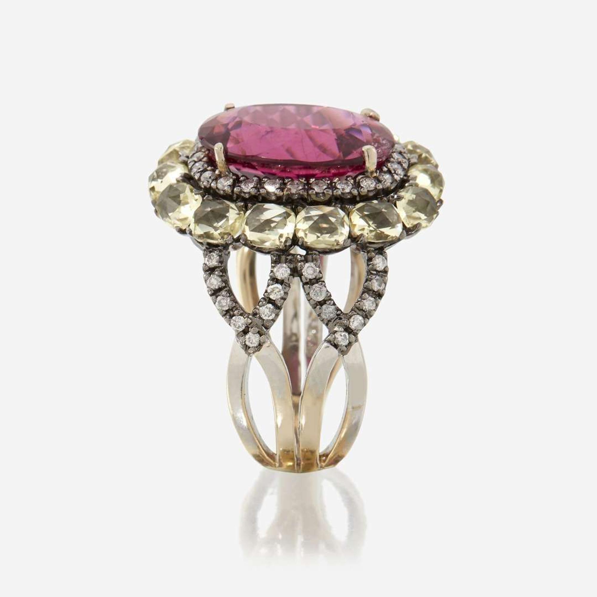 A pink tourmaline, peridot, diamond, and eighteen karat gold ring