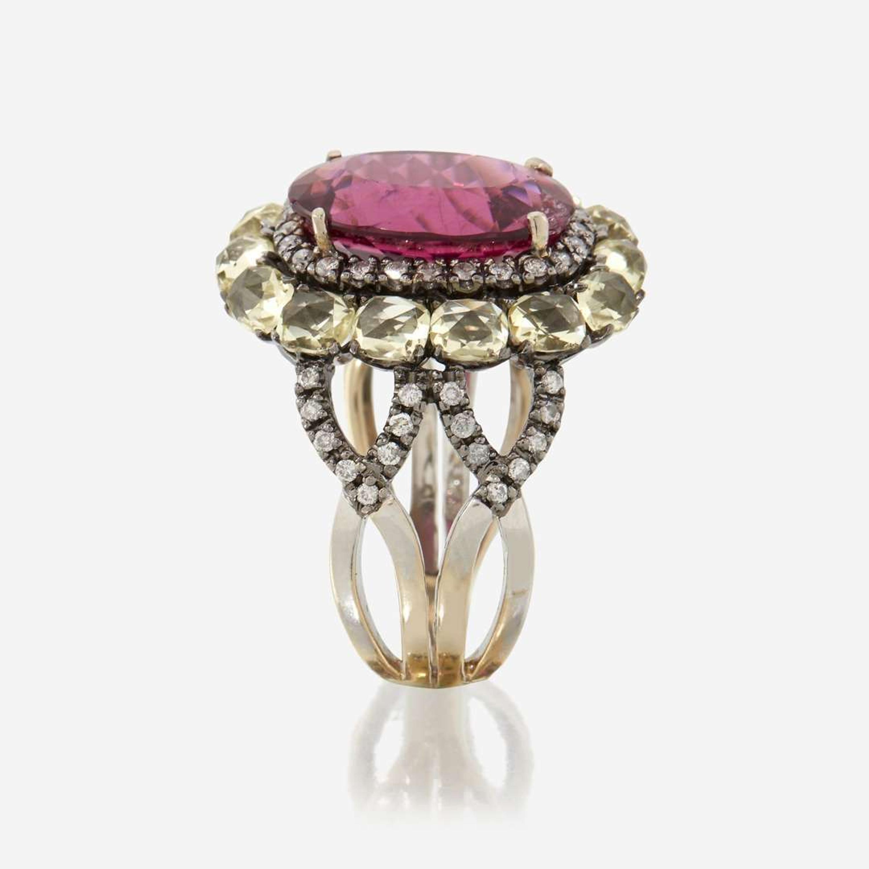 A pink tourmaline, peridot, diamond, and eighteen karat gold ring