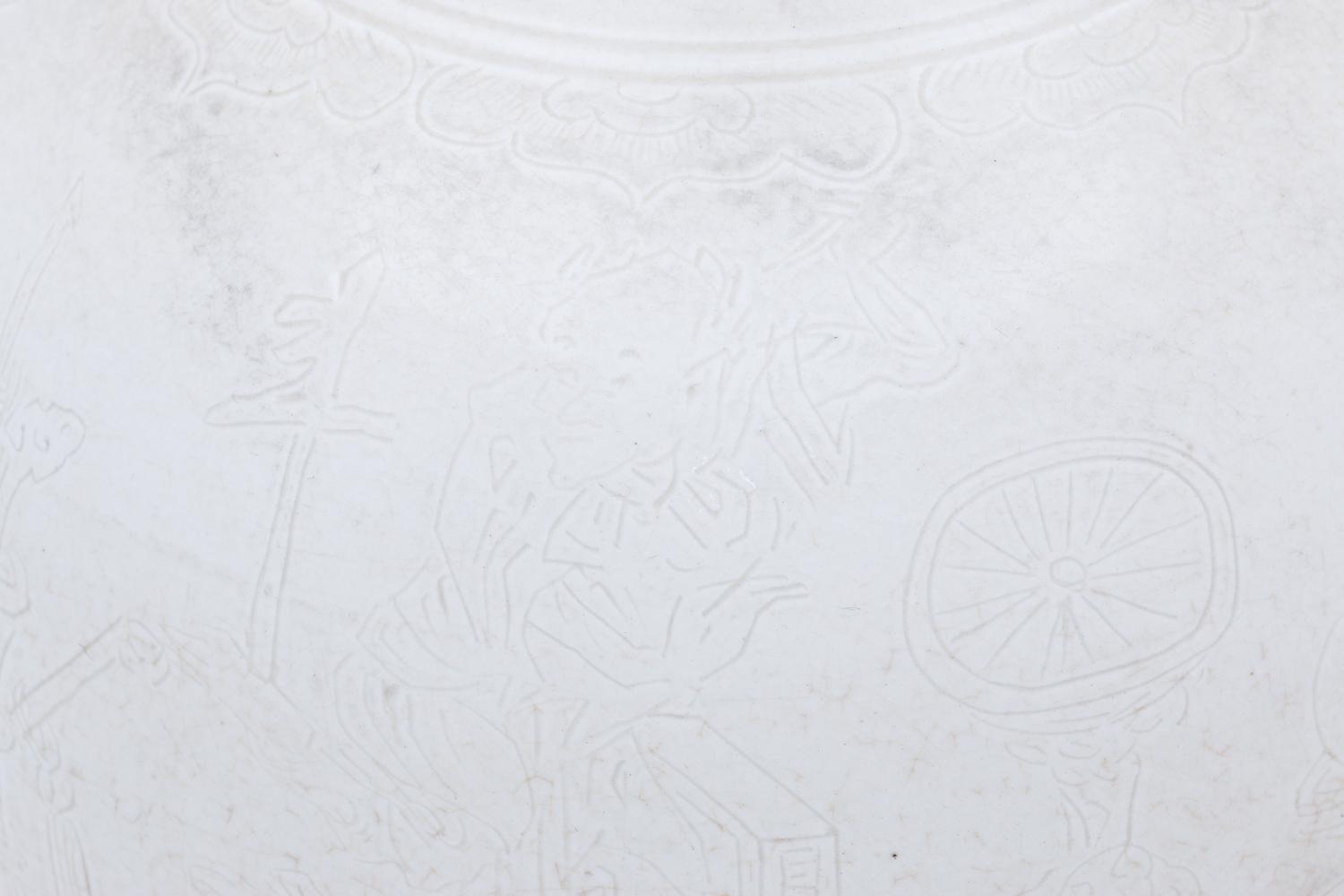Two White Glazed Anhua Decorated Vases