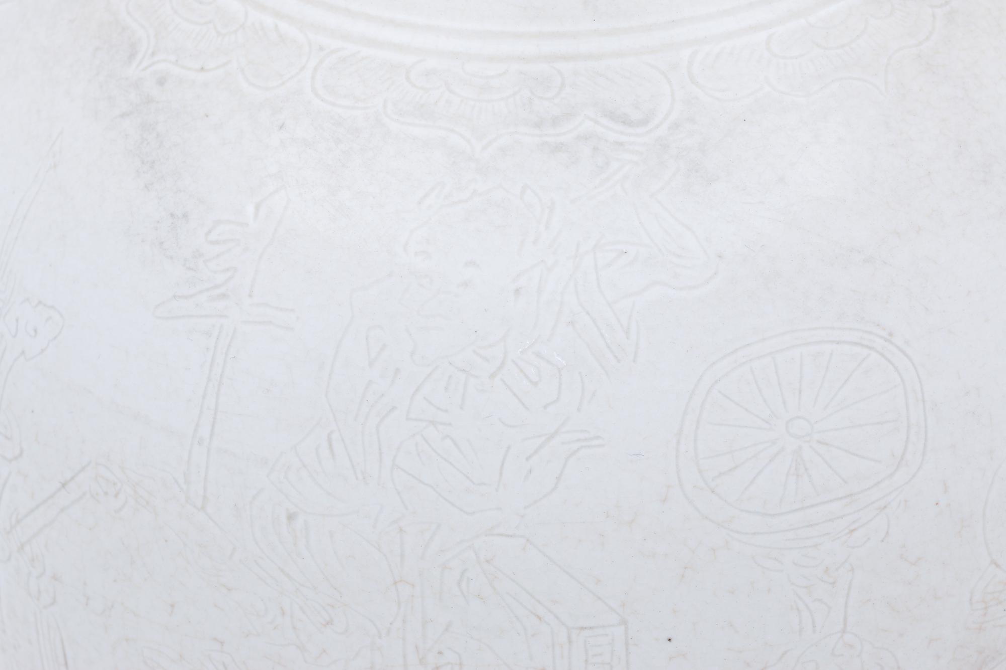 Two White Glazed Anhua Decorated Vases