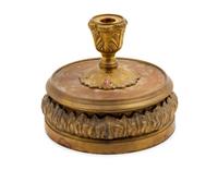 A French Empire Style Gilt Metal Candlestick