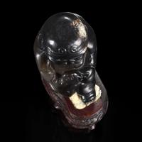 An unusual Chinese dark brown-black jade carving of a Lohan 笑狮罗汉玉雕 Ming dynasty or earlier ????