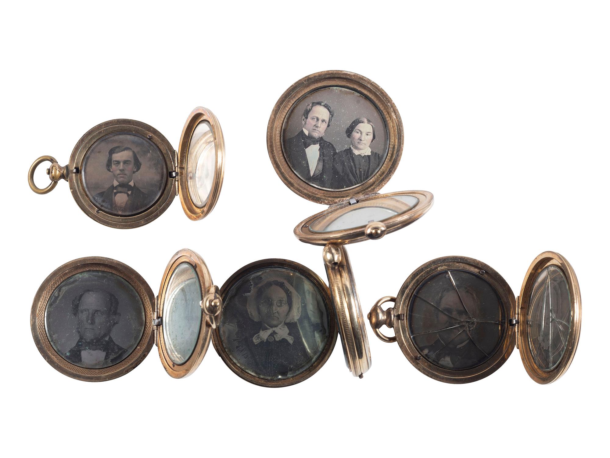 [EARLY PHOTOGRAPHY]. A group of 7 lockets containing 14 daguerreotypes including couples.