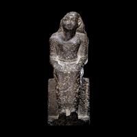 An Egyptian Diorite Seated Figure