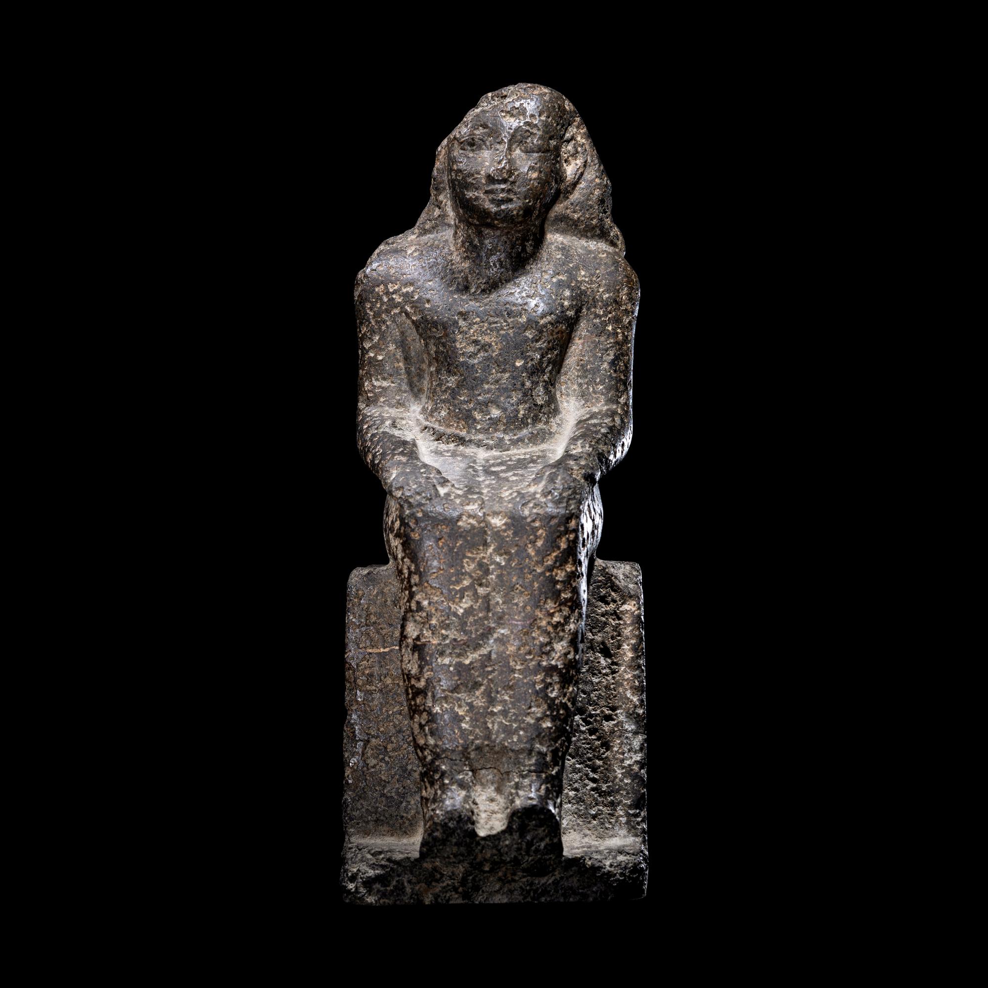 An Egyptian Diorite Seated Figure