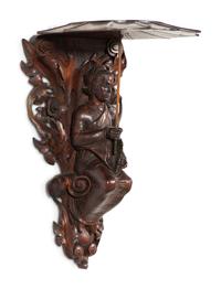 A Pair of Carved Oak Figural Wall Brackets