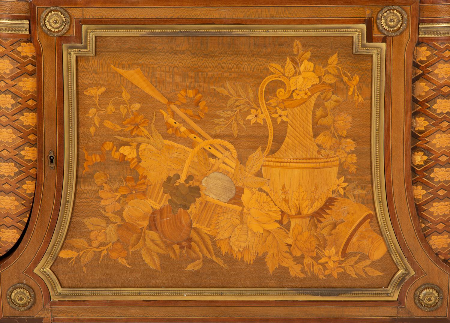 A Louis XVI Style Gilt Bronze Mounted Kingwood and Marquetry Marble-Top Commode
