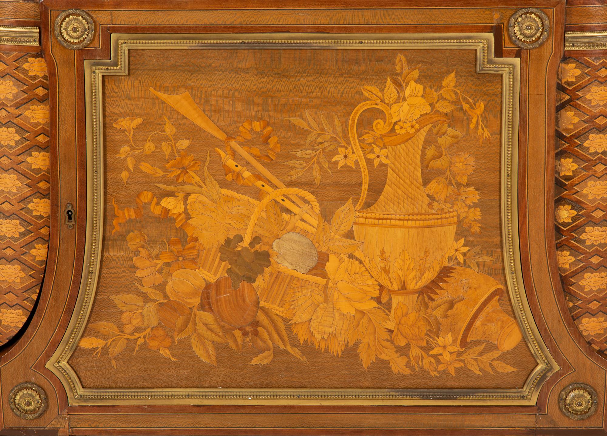 A Louis XVI Style Gilt Bronze Mounted Kingwood and Marquetry Marble-Top Commode