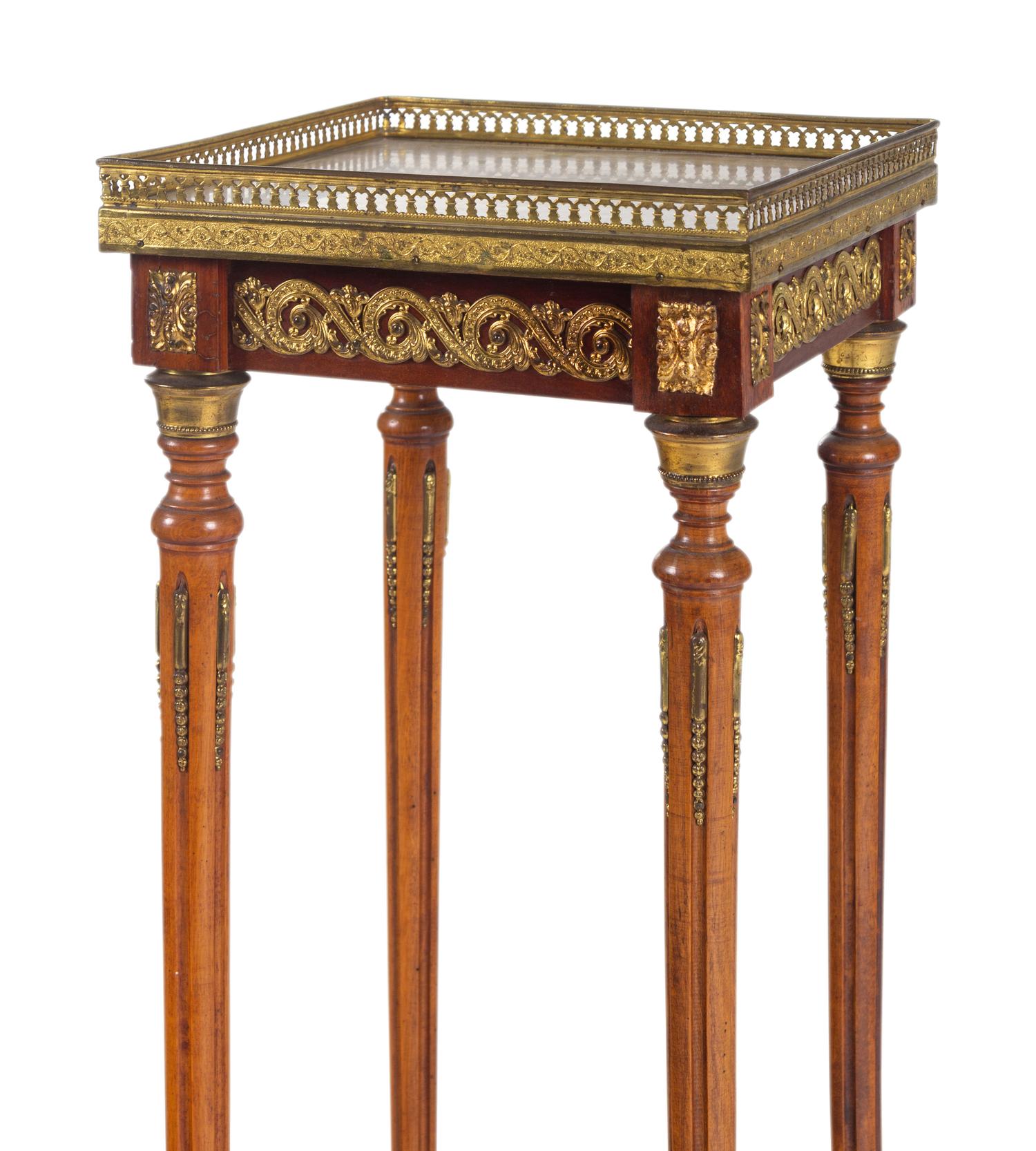 A Louis XVI Style Gilt Metal Mounted Onyx-Top Pedestal Table