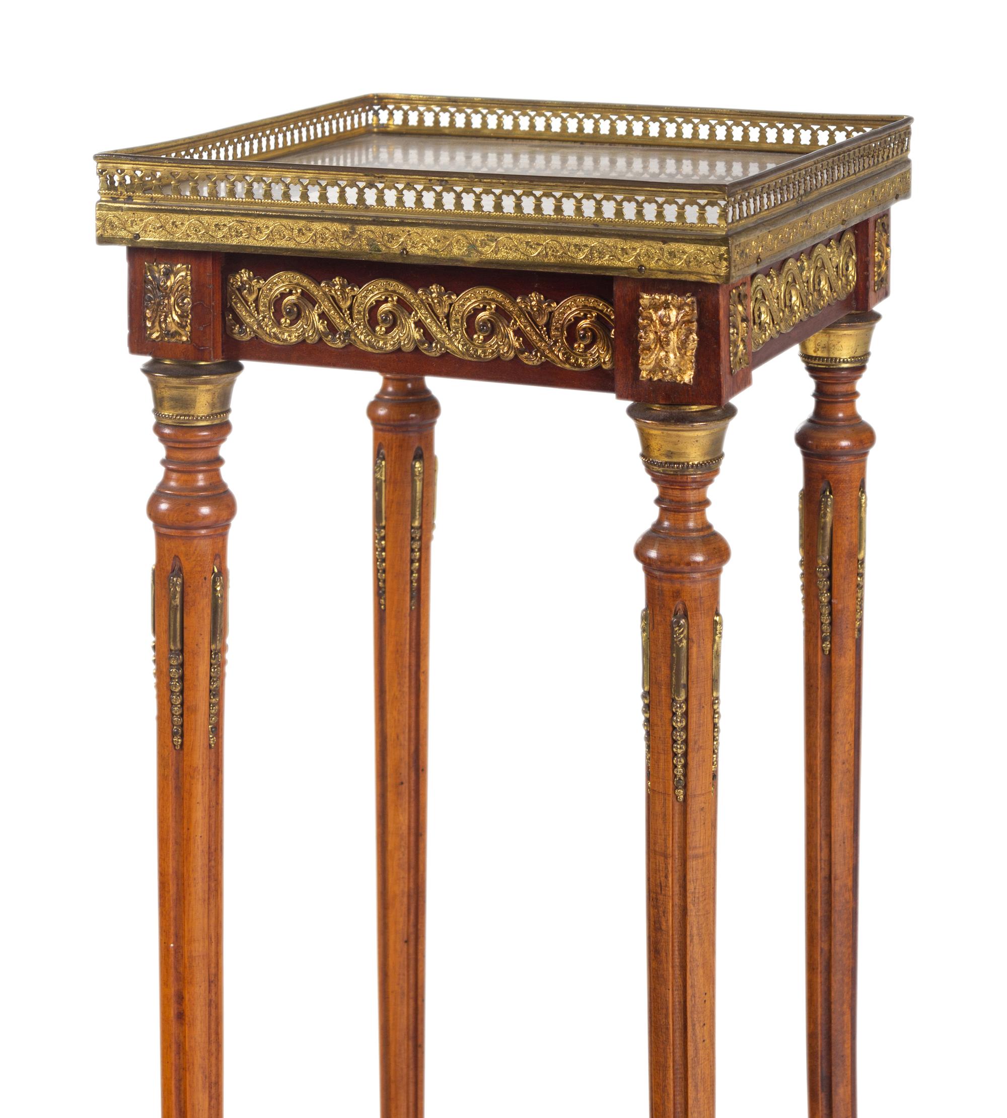 A Louis XVI Style Gilt Metal Mounted Onyx-Top Pedestal Table