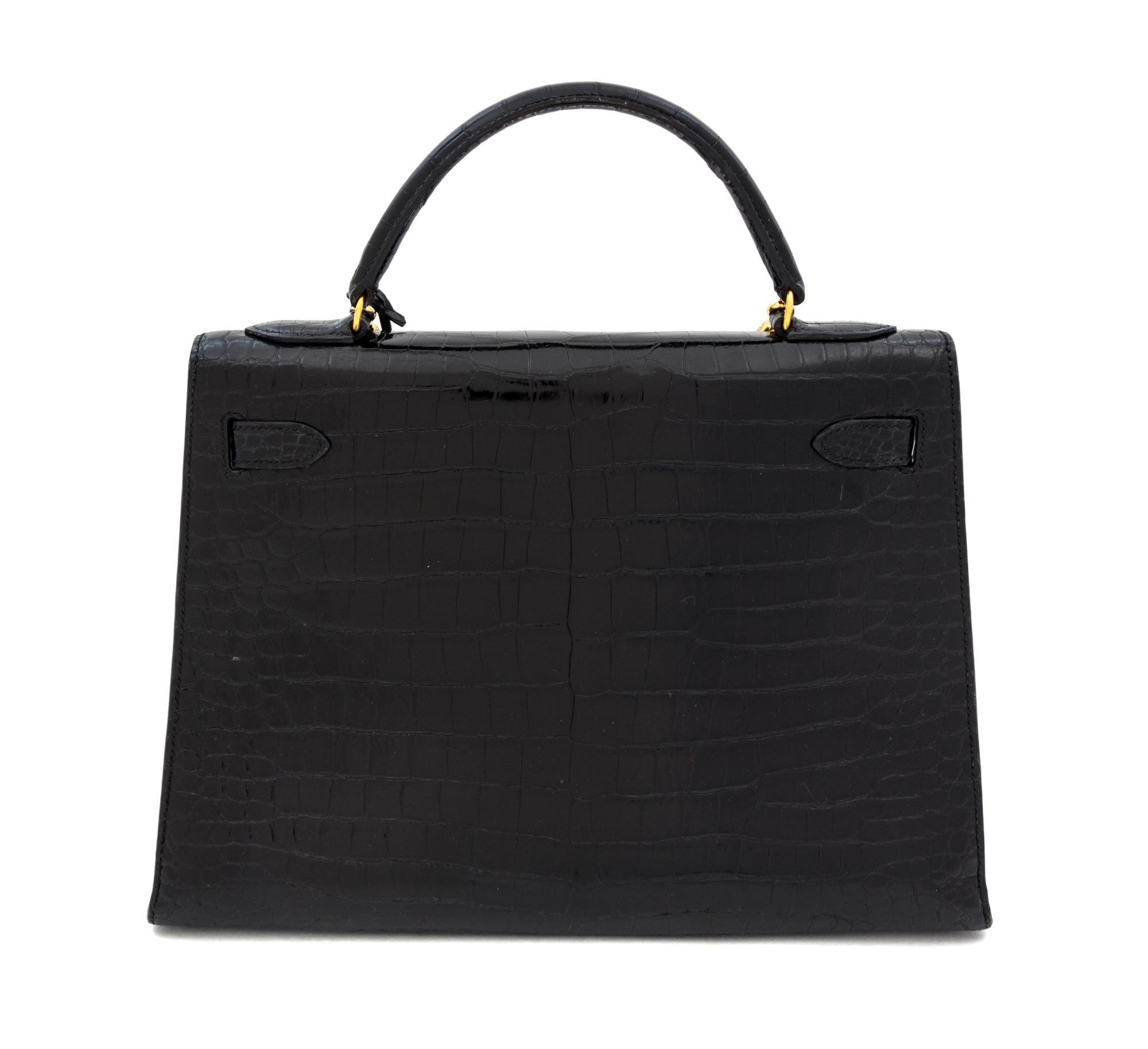 An Hermes 32cm Black Porosus Crocodile Kelly Bag, 12" x 9.5" x 4.5".