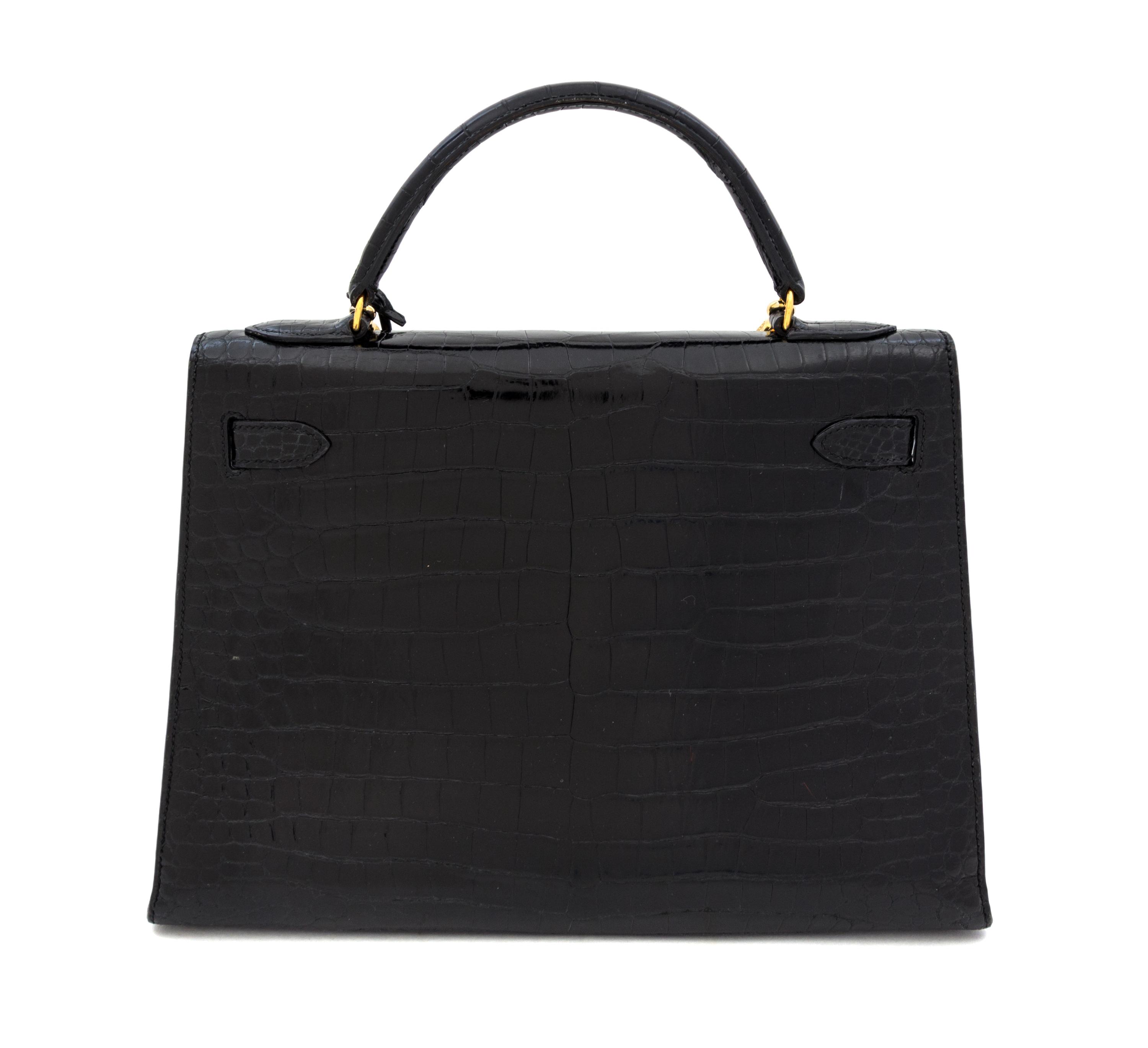 An Hermes 32cm Black Porosus Crocodile Kelly Bag, 12" x 9.5" x 4.5".