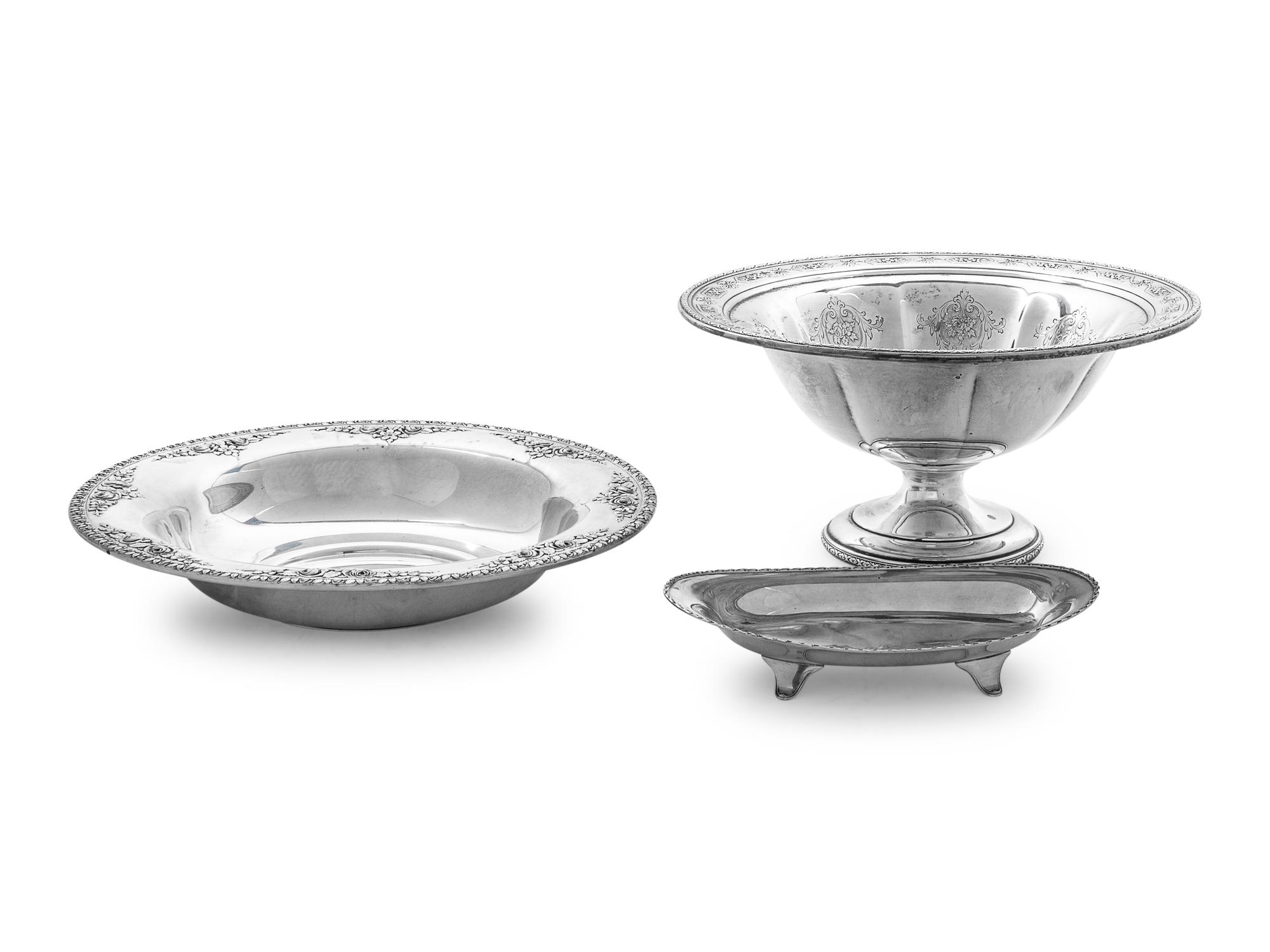 comprising two round platters and a small dish.