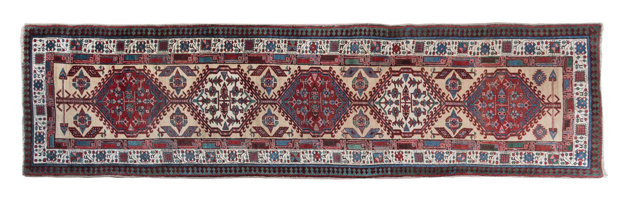 A Northwest Persian Wool Runner 10 feet 10 inches x 3 feet 1 inch.