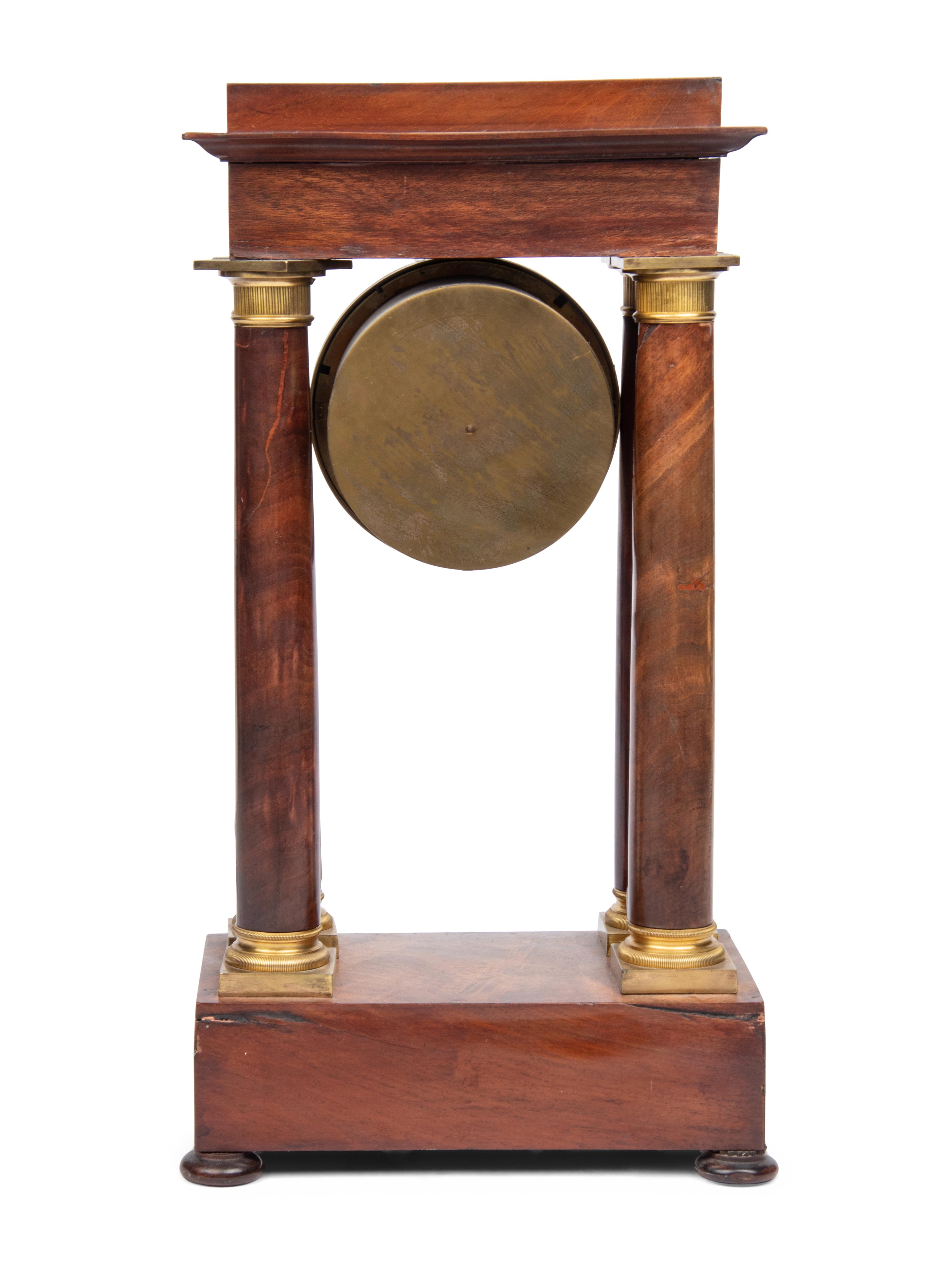 A Charles X Gilt Bronze Mounted Mahogany Portico Clock