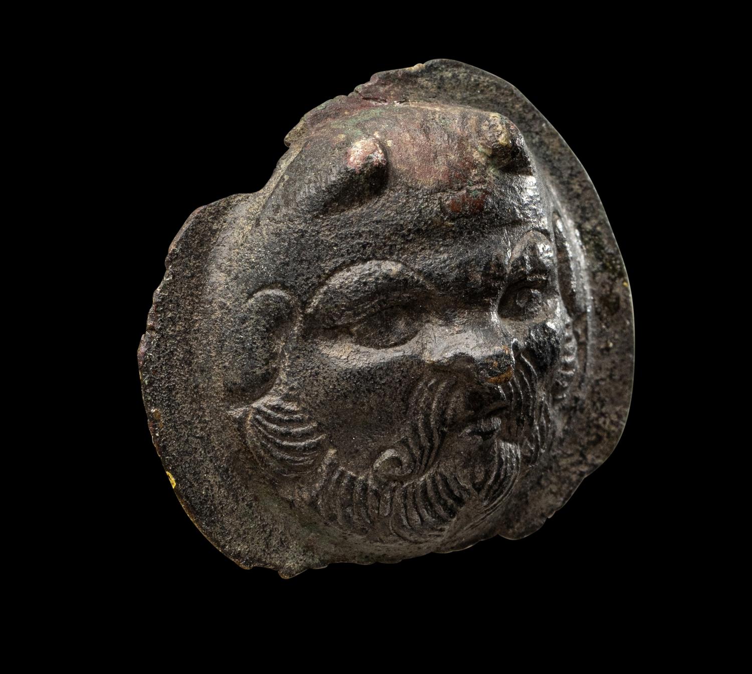 A Roman Bronze Boss with the Head of a Satyr
