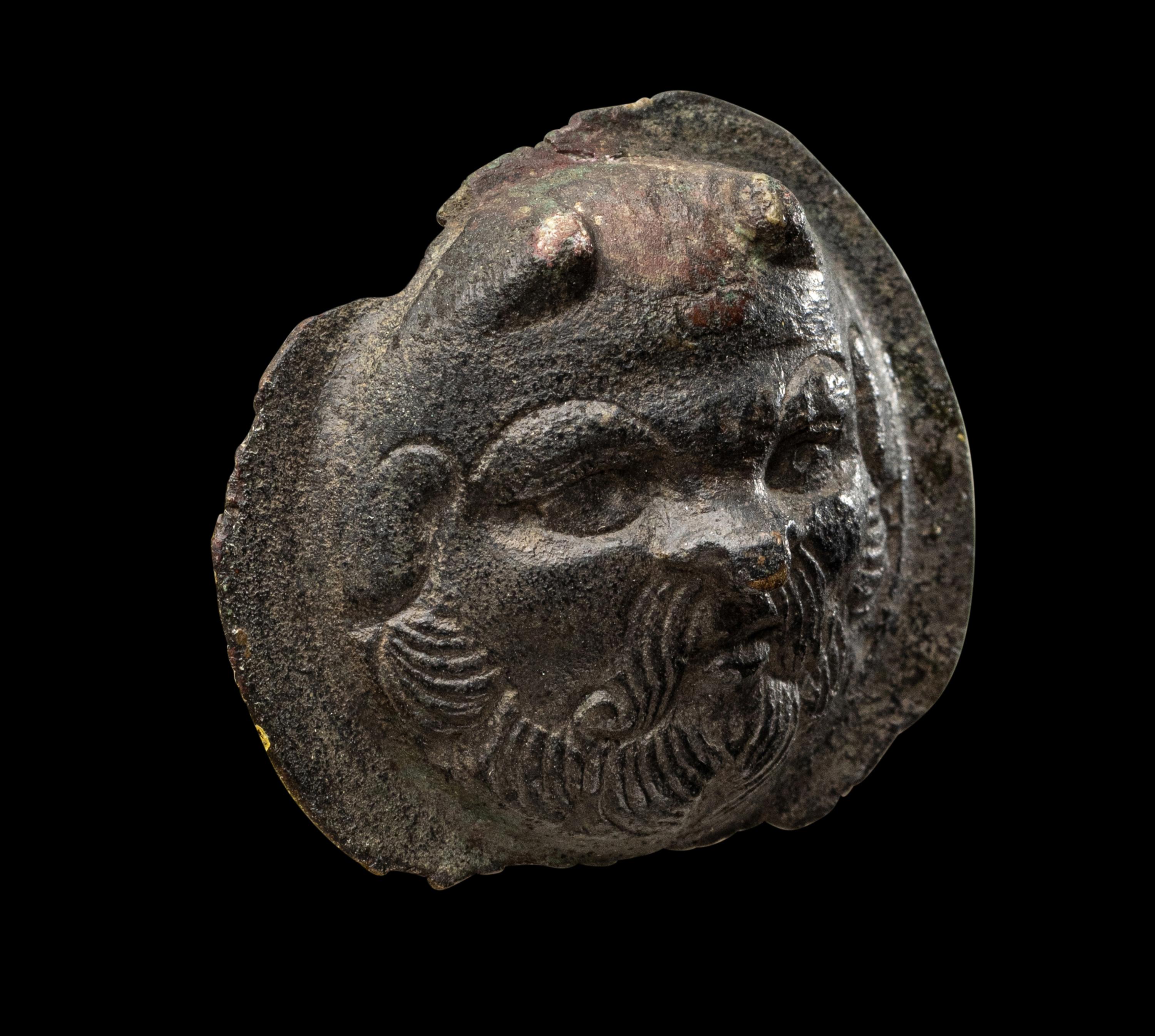 A Roman Bronze Boss with the Head of a Satyr