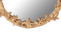 A Rococo Style Carved Giltwood Mirror