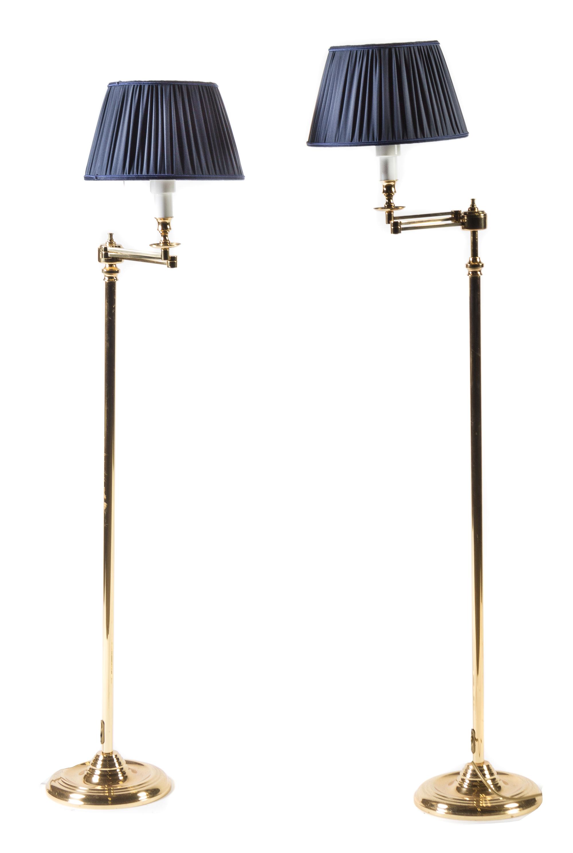 A Pair of Brass Swing-Arm Floor Lamps Height overall 48 1/2 inches. — 20TH CENTURY