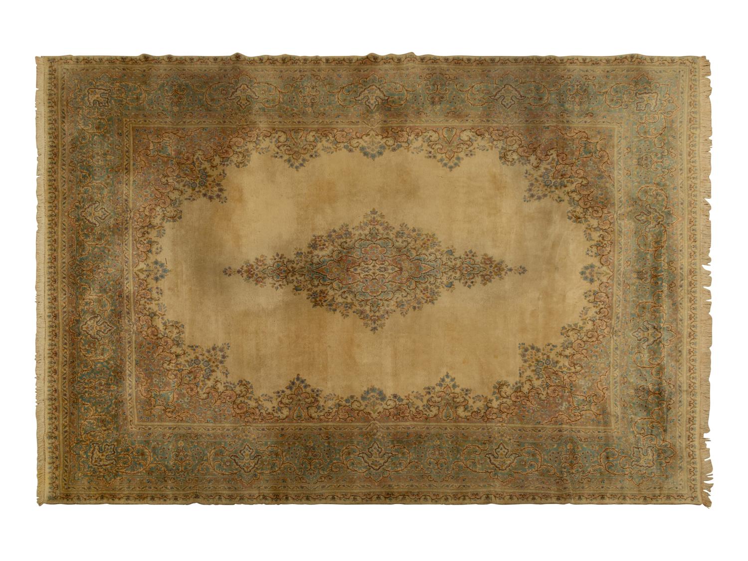 A Kirman Wool Rug — 20th Century