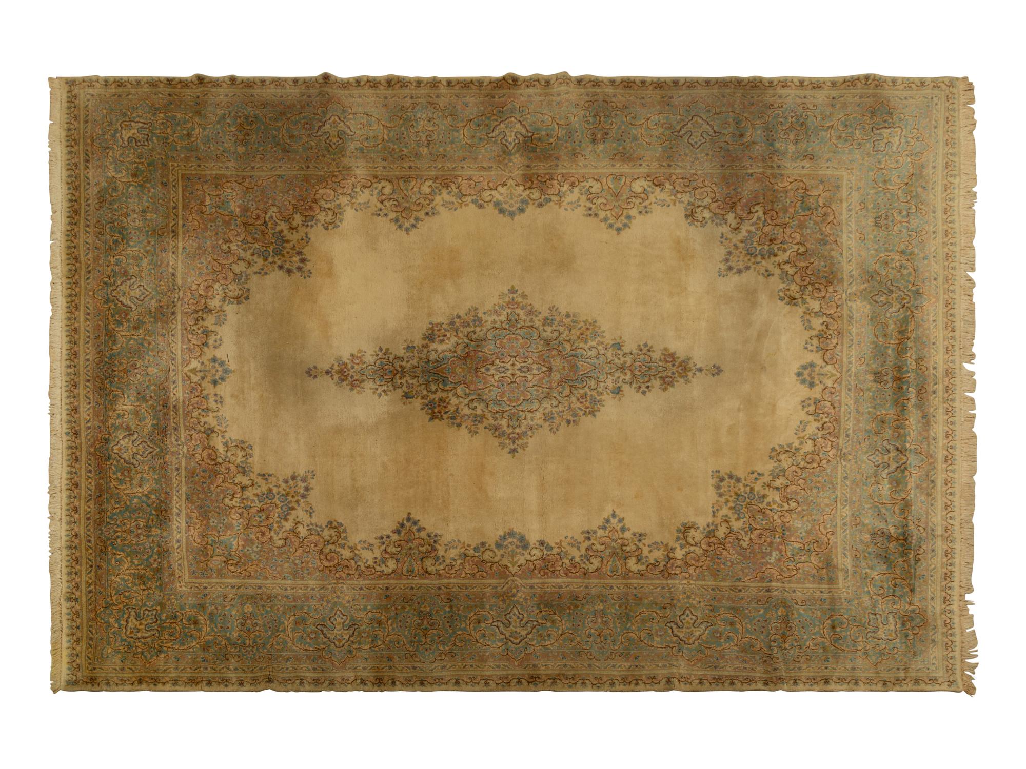 A Kirman Wool Rug — 20th Century