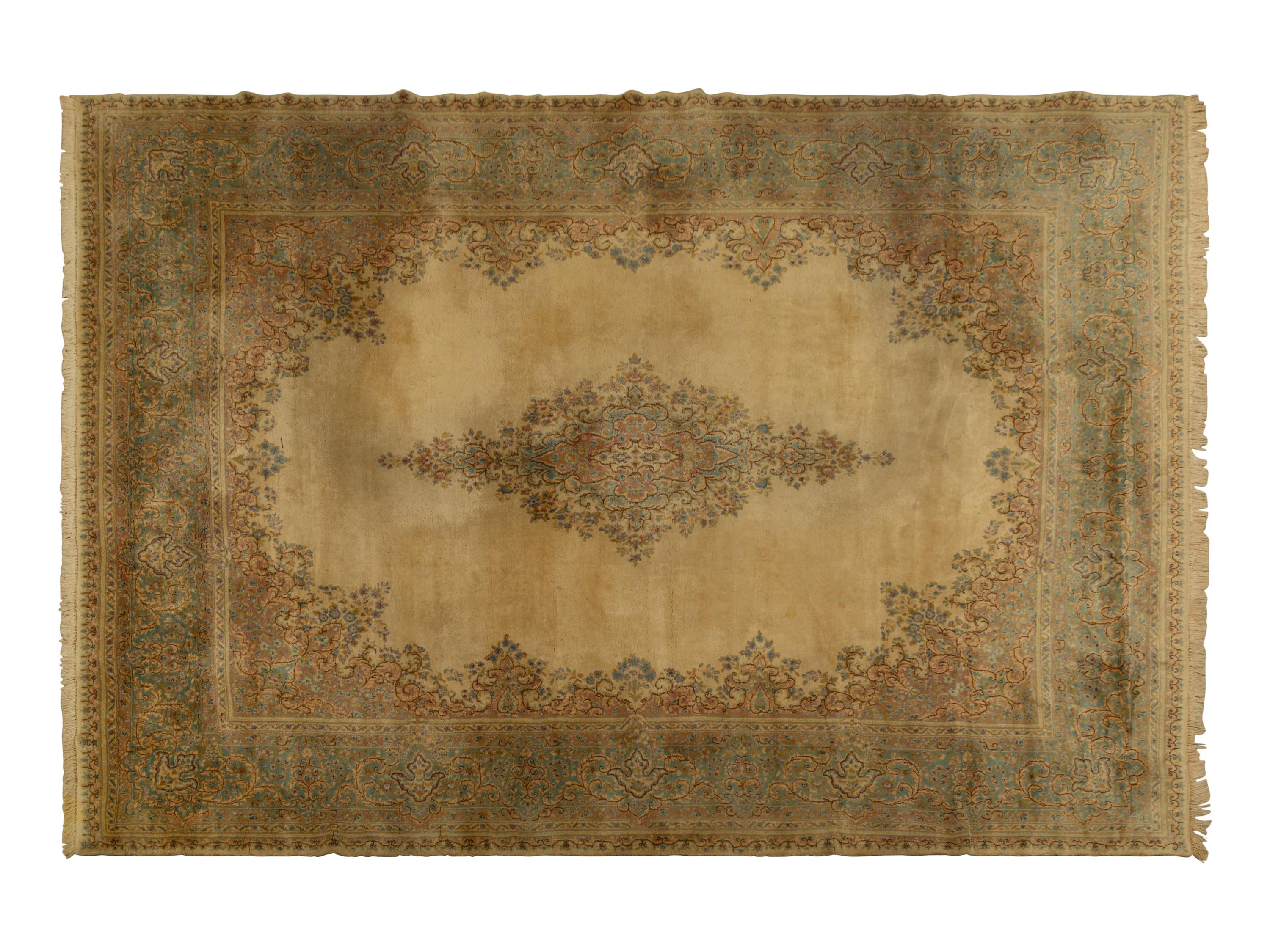 A Kirman Wool Rug — 20th Century