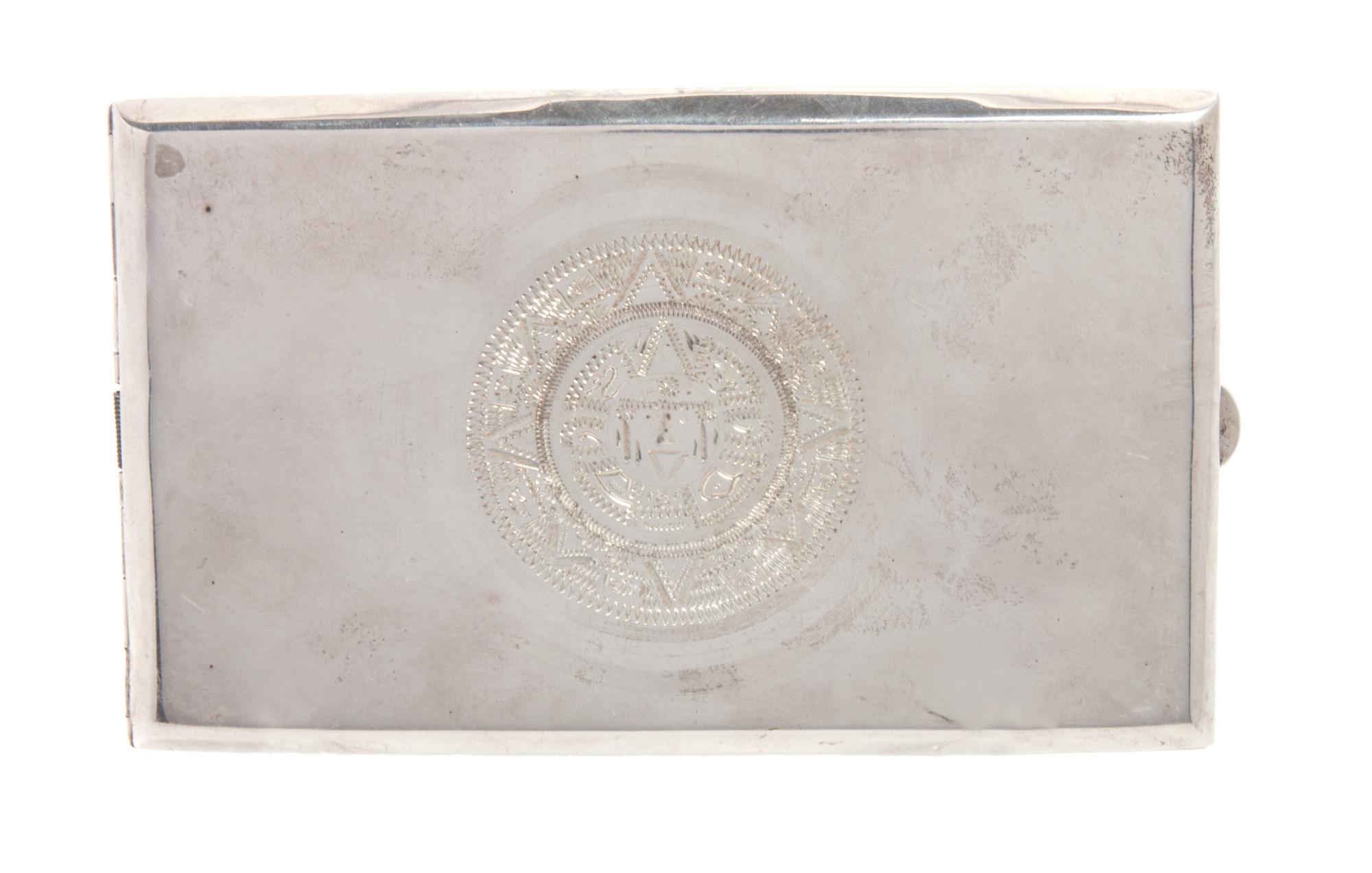 A Mexican Silver Cigarette Case, 20th Century, engraved with an Aztec style medallion on the cover.