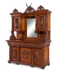 A Black Forest Style Carved Oak Serving Cabinet