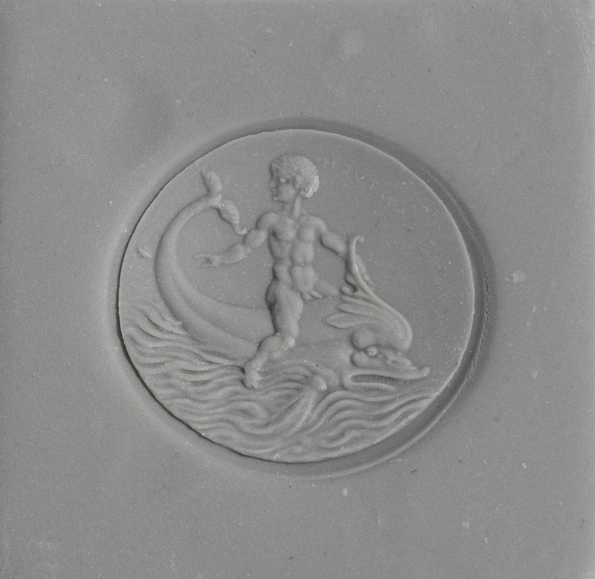 A Neoclassical Amazonite and Gold Finger Ring with the God Eros Riding a Dolphin and a Greek Inscription