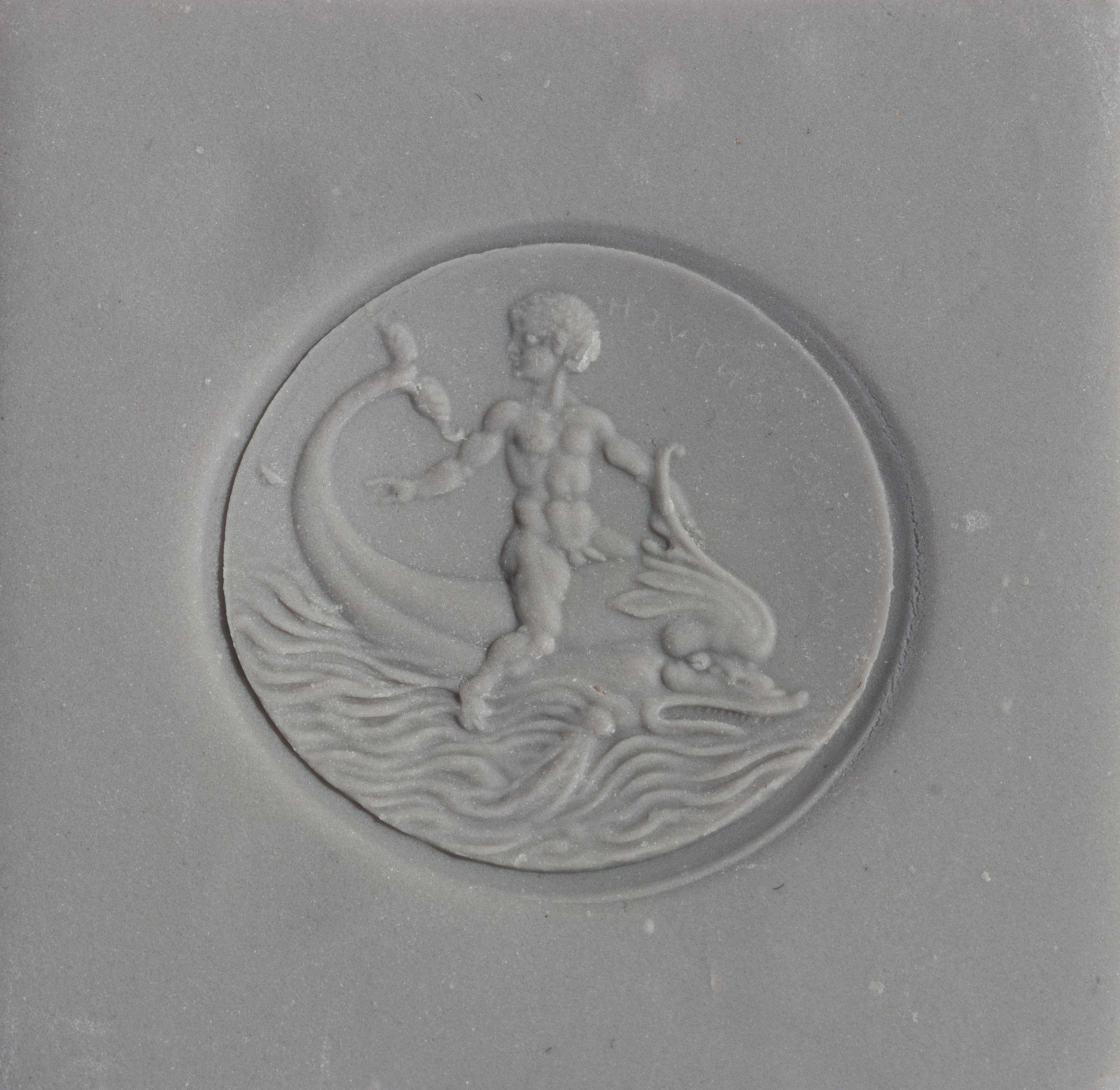 A Neoclassical Amazonite and Gold Finger Ring with the God Eros Riding a Dolphin and a Greek Inscription
