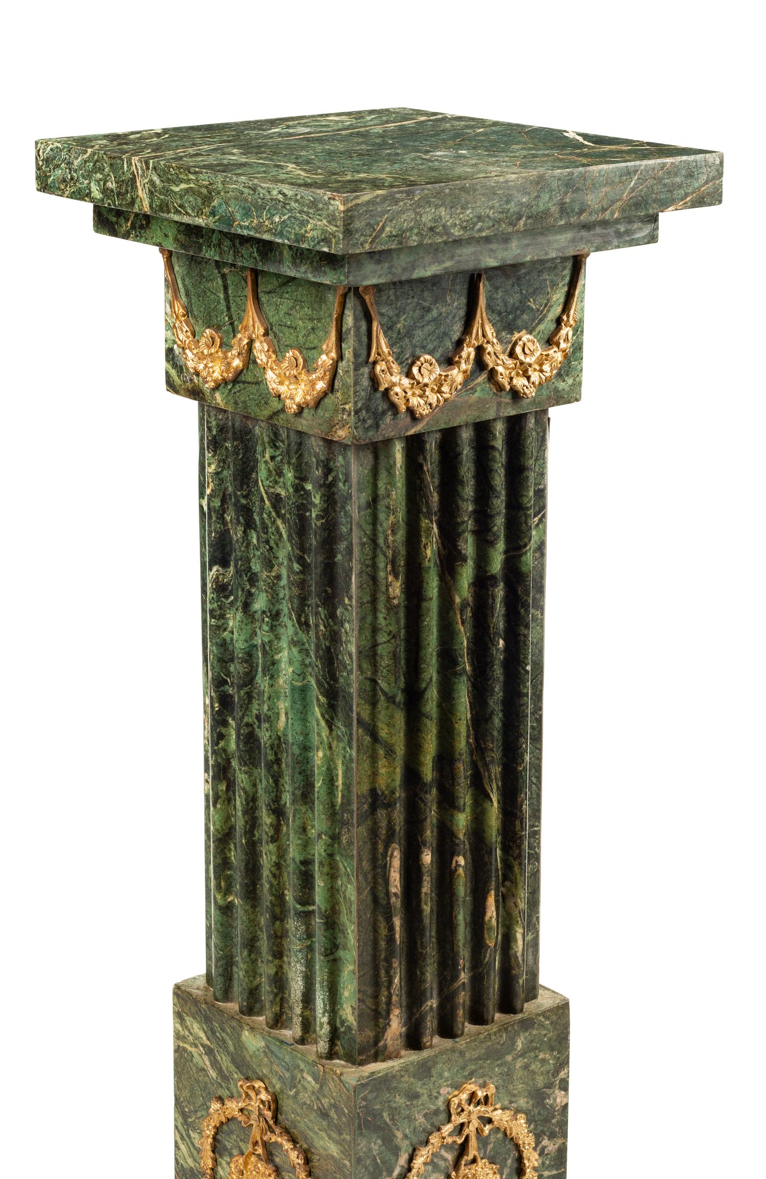 A Pair of Continental Gilt Bronze Mounted Marble Pedestals