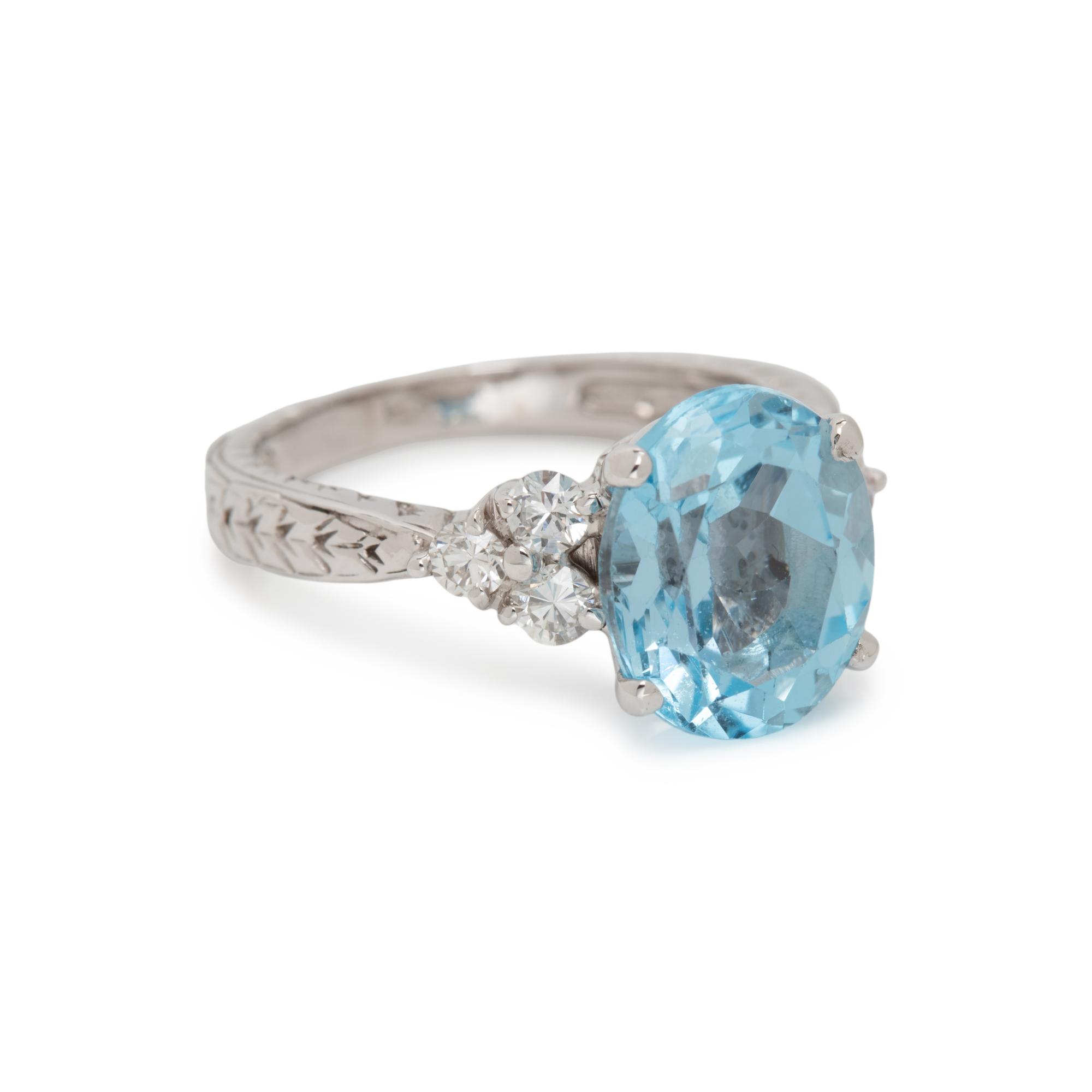 BLUE TOPAZ AND DIAMOND RING