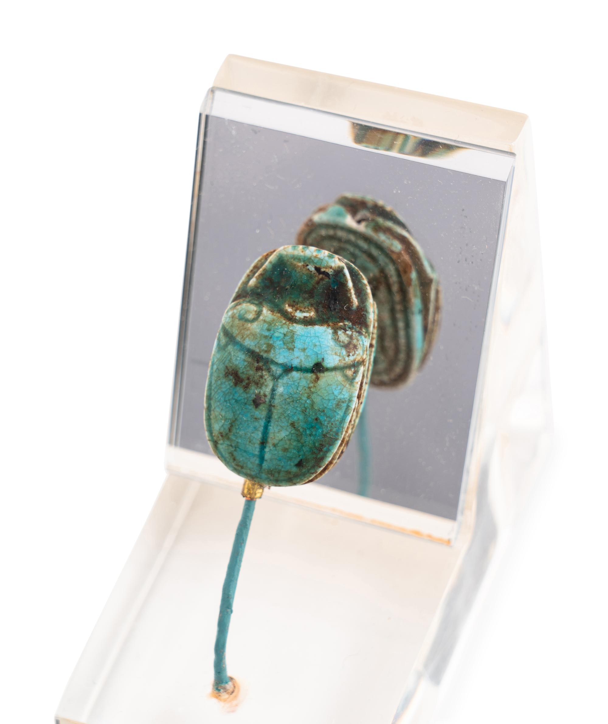 An Egyptian Faience Swivel Scarab