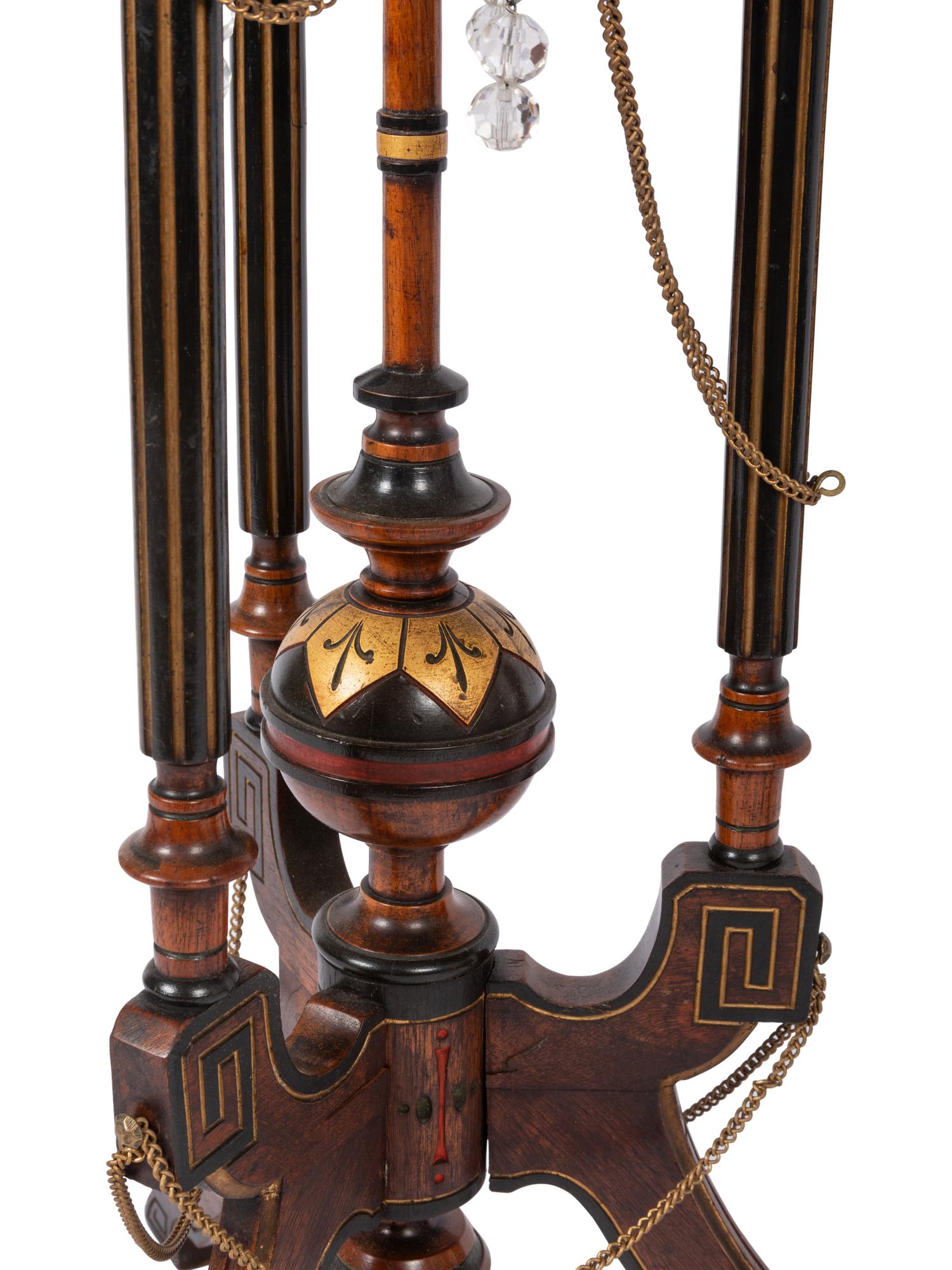 A Pair of Victorian Part-Ebonized and Gilt Walnut Plant Stands