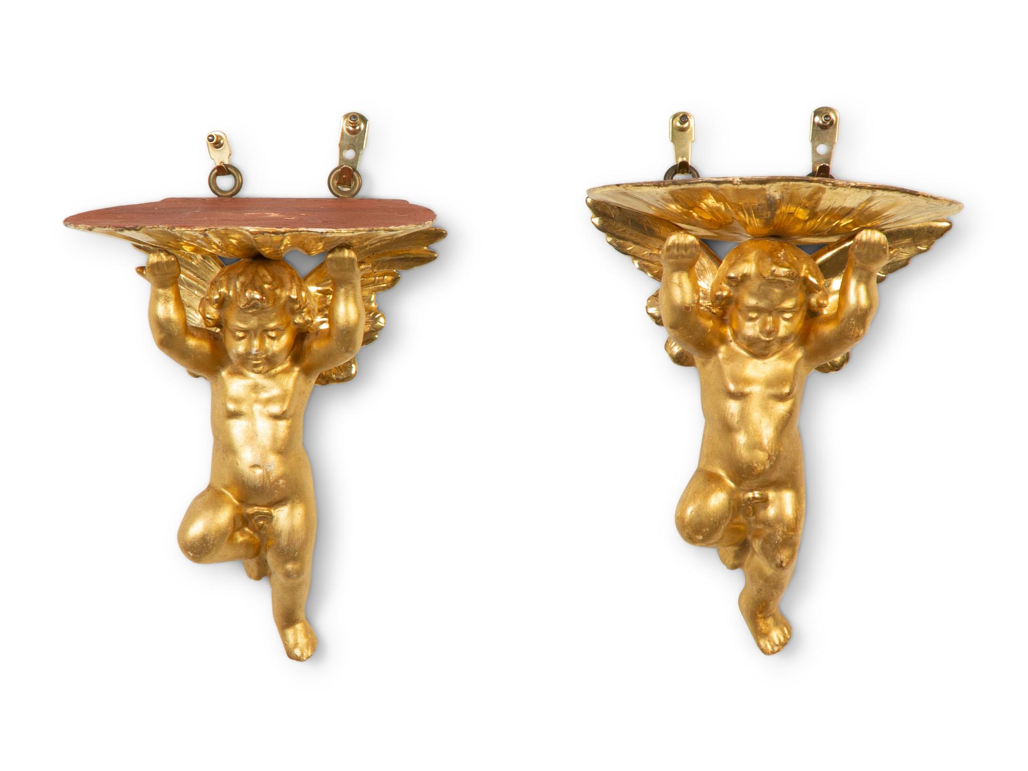 A Pair of Carved Giltwood Putti Wall Brackets