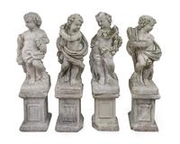 A Group of Four Cast Stone Figures on Columnar Bases — 19TH/20TH CENTURY