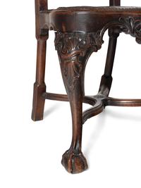 A Pair of Portuguese Carved Walnut and Tooled Leather Hall Chairs