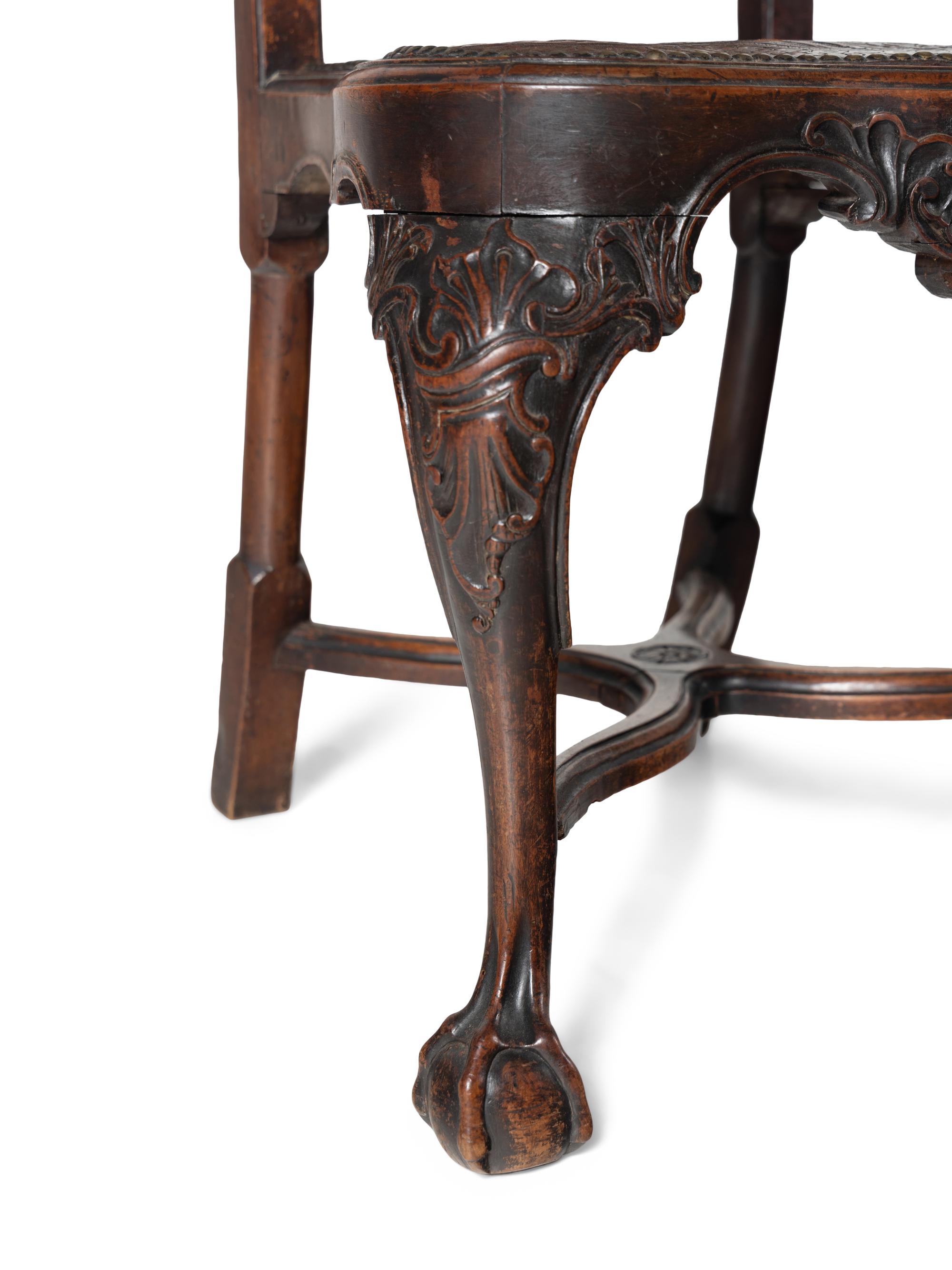 A Pair of Portuguese Carved Walnut and Tooled Leather Hall Chairs