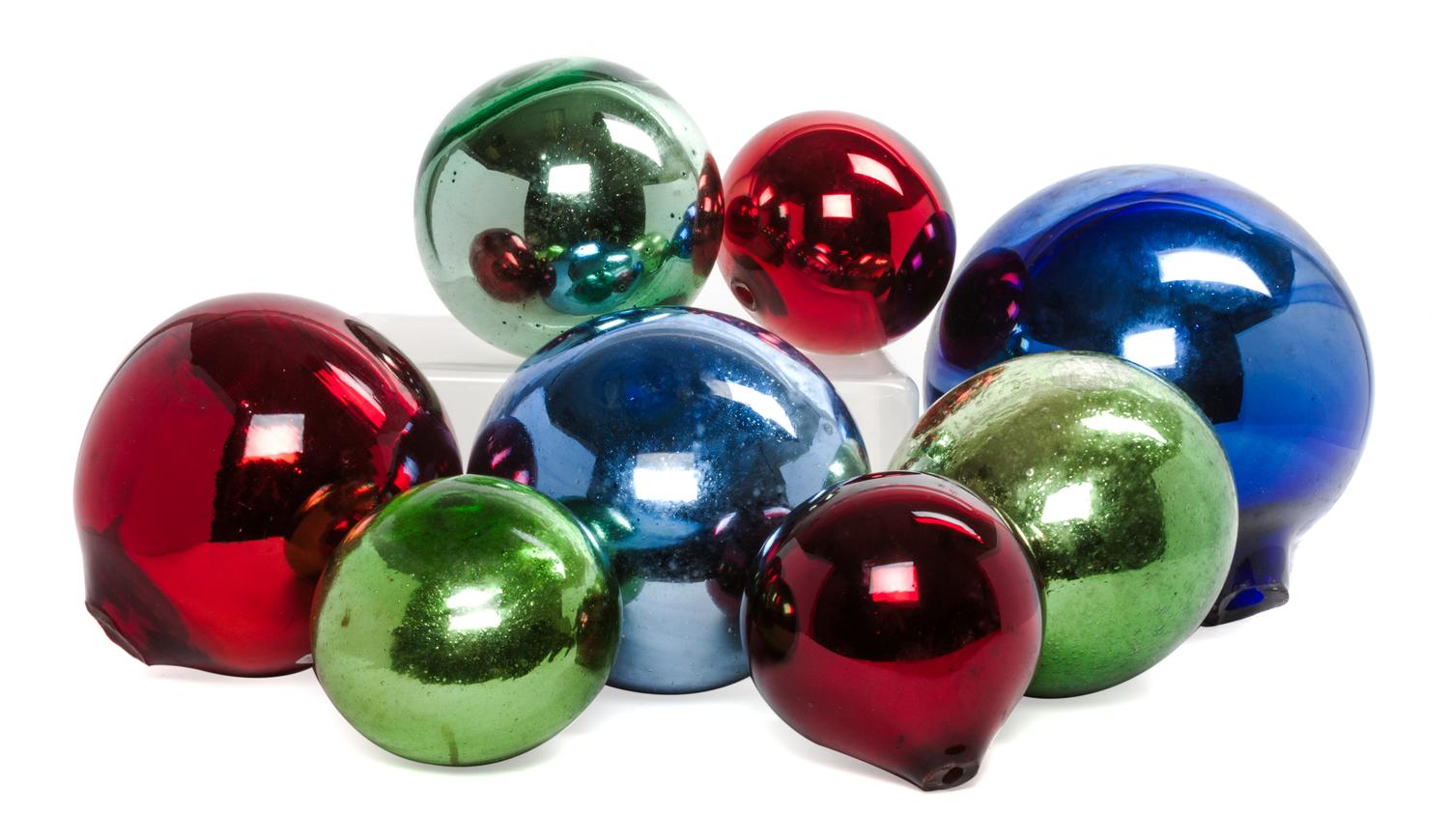 A Collection of Eight Mercury Glass Spheres Diameter of largest 10 1/2 inches.