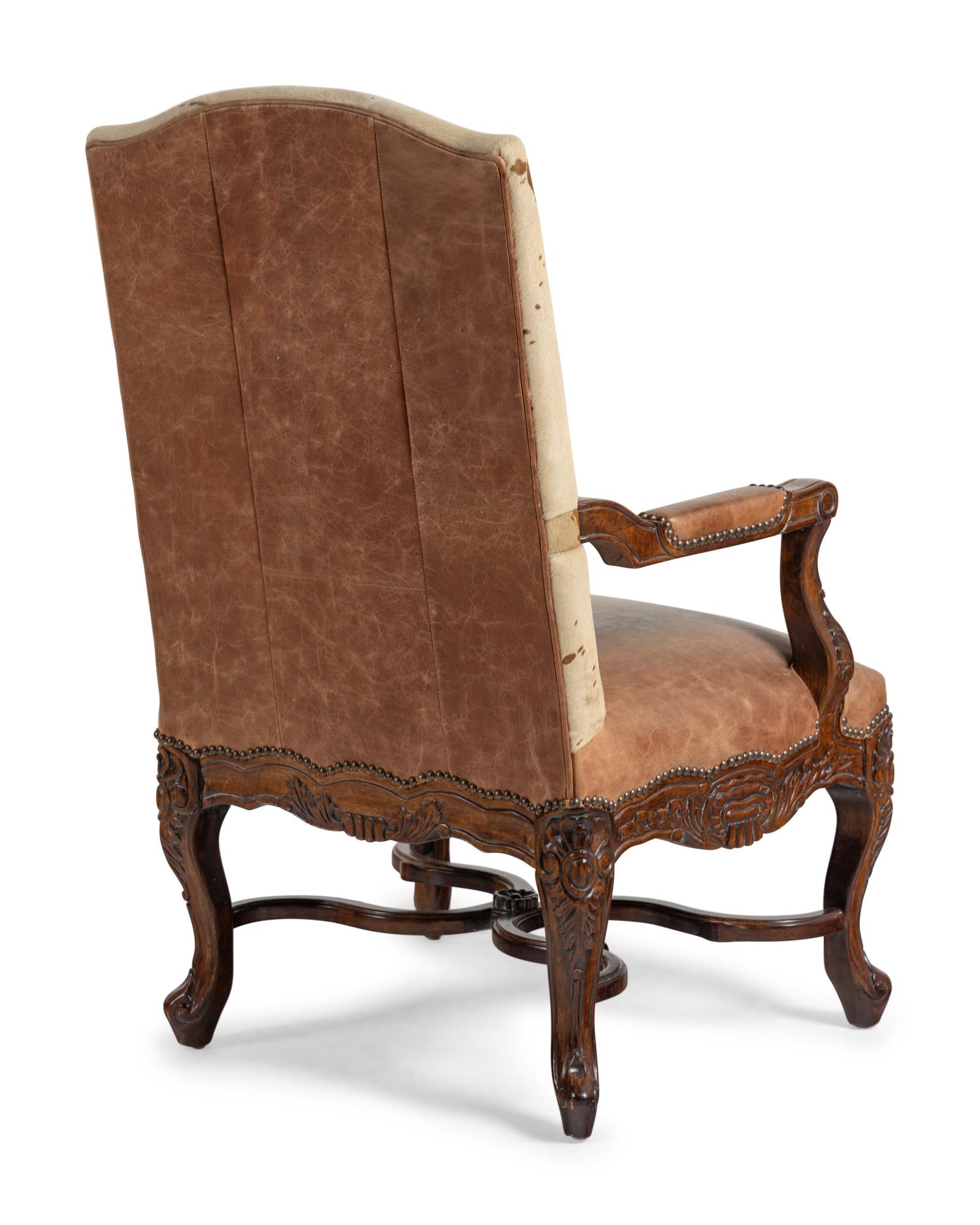 A Pair of Louis XV Style Carved Walnut Fauteuils