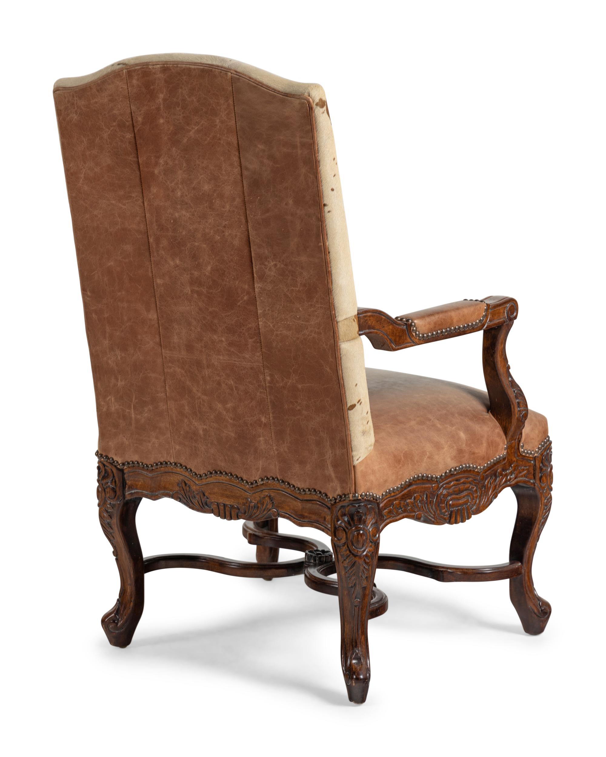 A Pair of Louis XV Style Carved Walnut Fauteuils