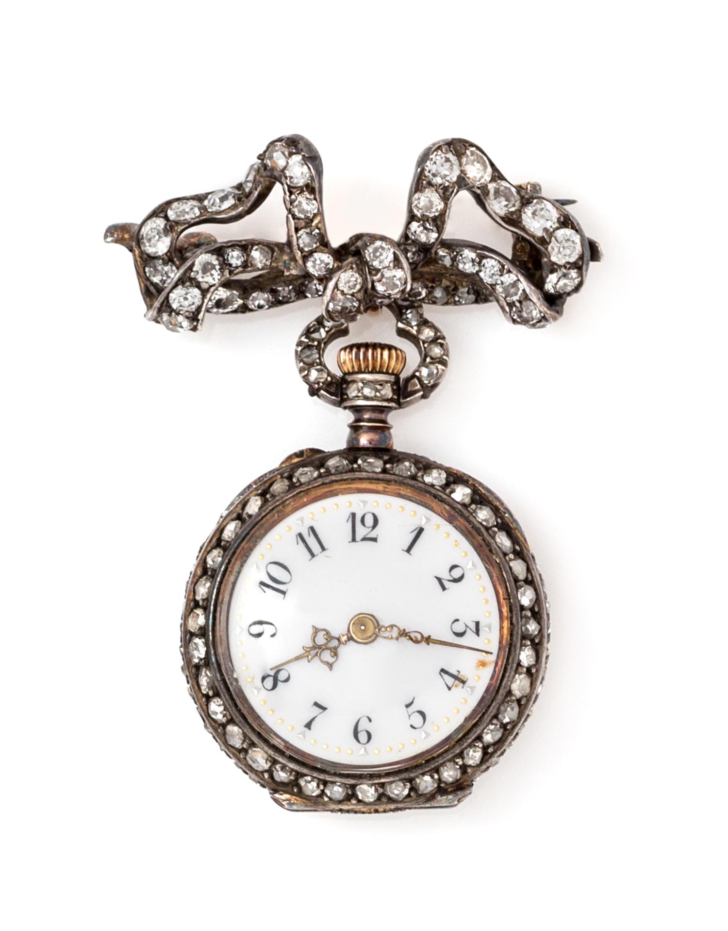 A Silver, Gold and Diamond Lapel Watch, 13.00 dwts.