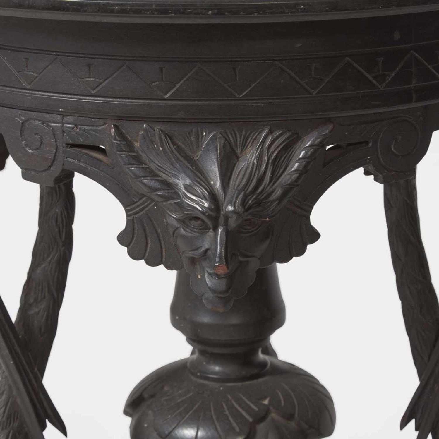 An Aesthetic Movement carved and ebonized wood pedestal with cranes late 19th century