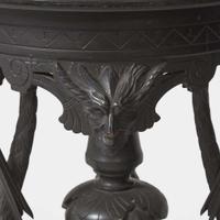 An Aesthetic Movement carved and ebonized wood pedestal with cranes late 19th century